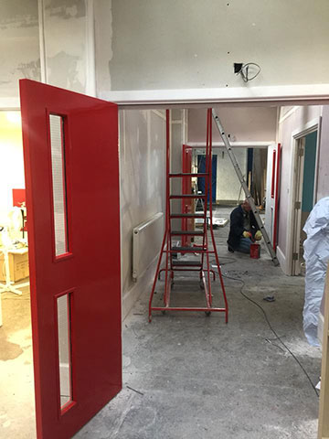 Red doors lead the way to meeting rooms
