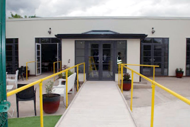 finished entrance yellow rails seating and landscaping