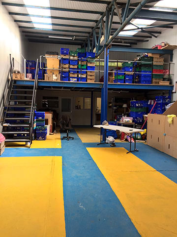 multi level storage area with stairs boxes painted floor