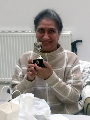 Member presented with bowling trophy